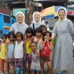 with linchangco feeding children in the village